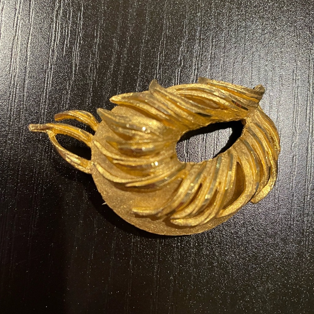 BSK gold tone brooch